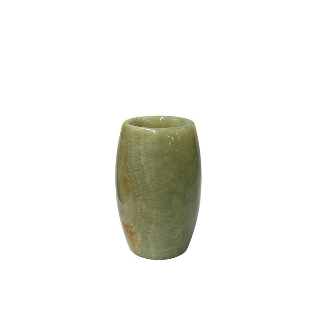 This exquisitely crafted vessel is carved from natural green color stone, showcasing a smooth, polished surface that...