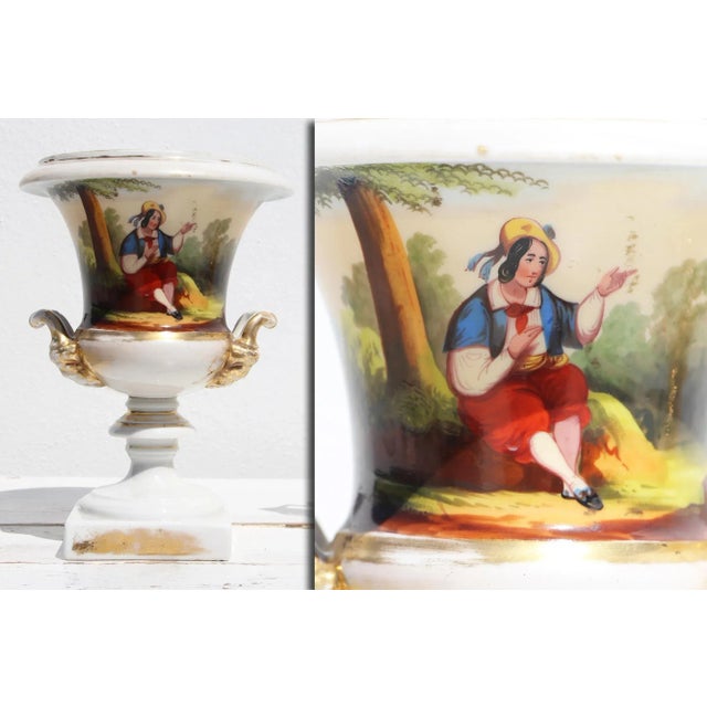 A Pair of Paris Porcelain Campana-Form Urns, and a Paris Porcelain Reticulated Basket Compote, 19th Century Circa: 19th...