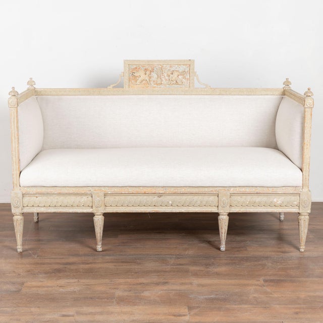Early 19th century Swedish Gustavian bench or settee crafted in pine. The top rail features egg-and-dart molding and is...