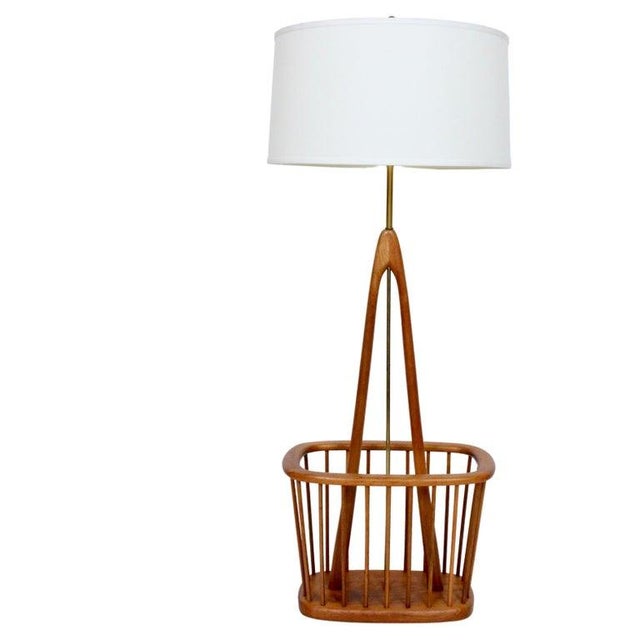 Mid Century Sculptural Arthur Umanoff attributed Teak and Brass Floor Lamp with Storage. Featuring a versatile turned Teak...