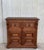 About From Northern Spain, constructed of solid walnut, the rectangular top with molded edge atop a conforming case...