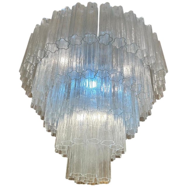 Murano glass ceiling lamp designed by Paolo Venini in the 1980s. It features a circular silver structure from which hang...