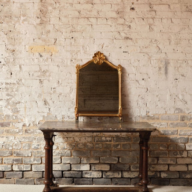 Add elegant movement and timeless charm to your space with this 1940s French Rococo style mirror, a beautifully crafted...