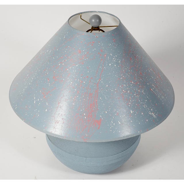 This Flute of Chicago corrugated cardboard table lamp from the 1980s features a distinctive splatter-painted shade.