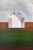 On the Outskirts by Justin Wheatley | Acrylic on Canvas White Barn in Open Field For Sale