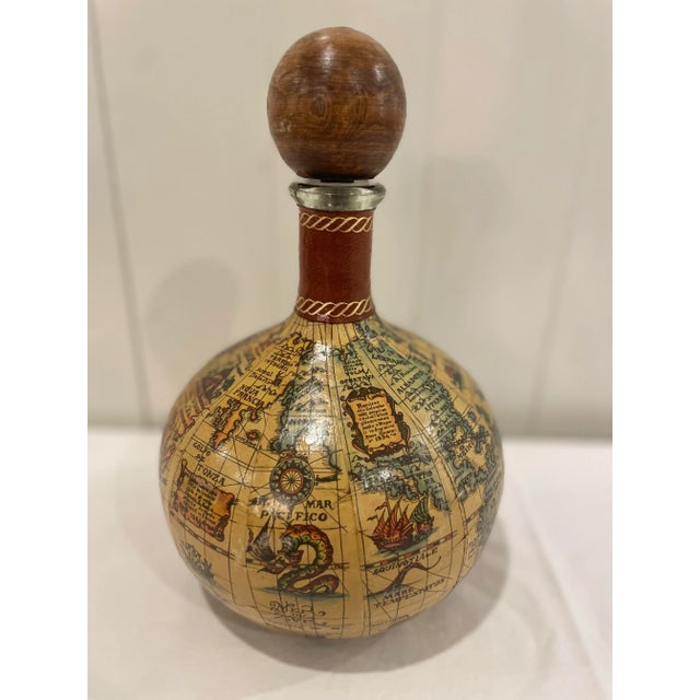Great addition to your bar! Vintage Italian map liquor decanter with wood stop and leather accent. No makers mark. Minor...
