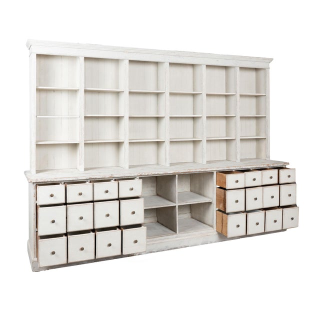 19th-century Danish pine shop cabinet/counter, traditionally known as a Danish grocer’s desk. The newer, white painted...