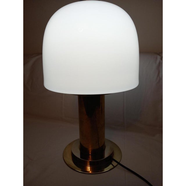 The table lamp is in its original condition equipped with 1 E27 socket. no damage, ready to use. This piece has an...