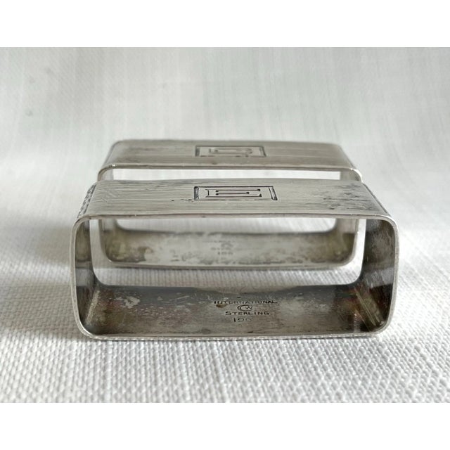 A lovely pair of Art Deco era Sterling napkin rings by Watrous Mfg of Wallingford CT. They are monogrammed “E” and “C”....
