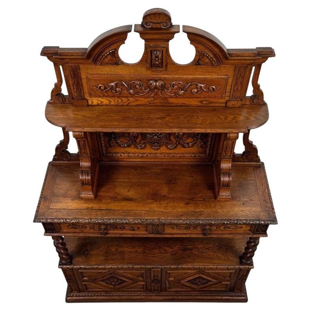 An impressive 19th-century English sideboard, finely crafted from golden oak and distinguished by its elaborate carved...