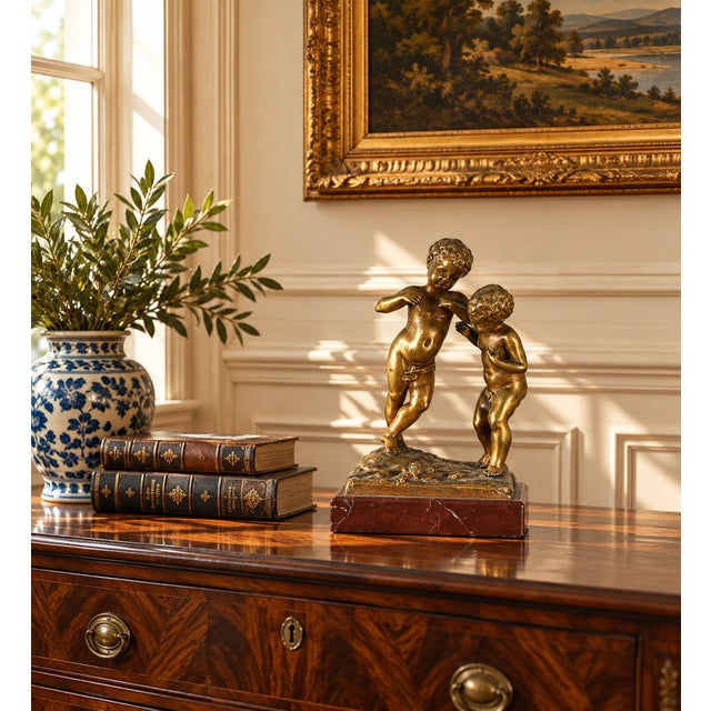This Antique Bronze Sculpture “Jeunes Garçons” by the French artist Louis Kley (1833-1911) beautifully captures the...