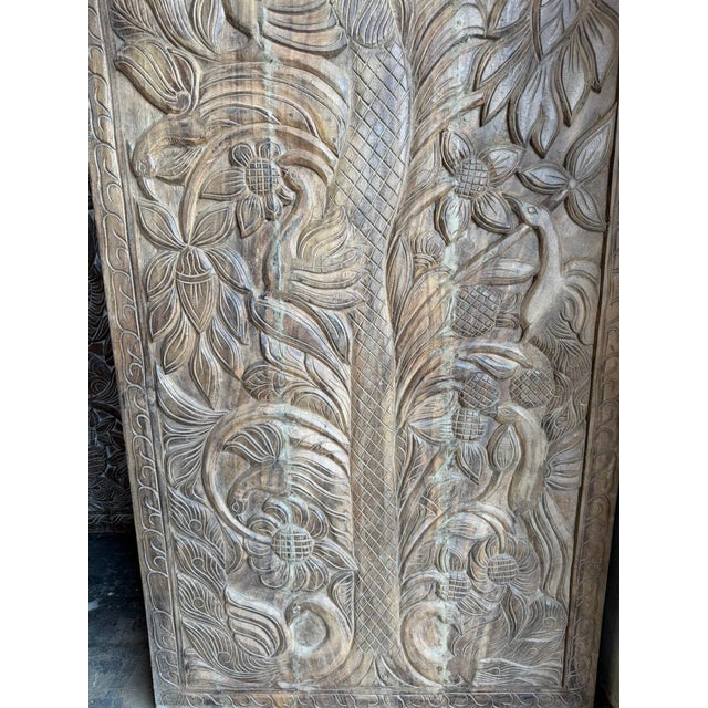 Bring warmth, craftsmanship, and timeless symbolism into your home with this hand-carved wooden Tree of Life wall panel....