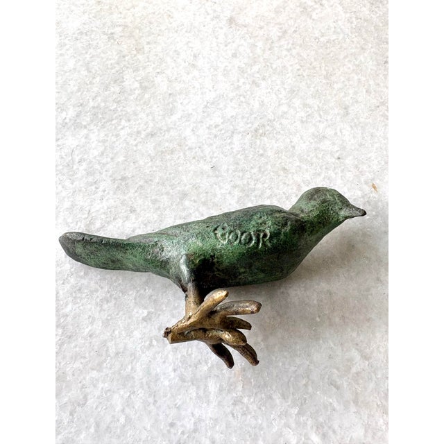 Cast bronze bird sculpture designed by Ilana Goor.The sculpture features a green, textured patina finish indicative of...