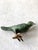 Cast bronze bird sculpture designed by Ilana Goor.The sculpture features a green, textured patina finish indicative of...