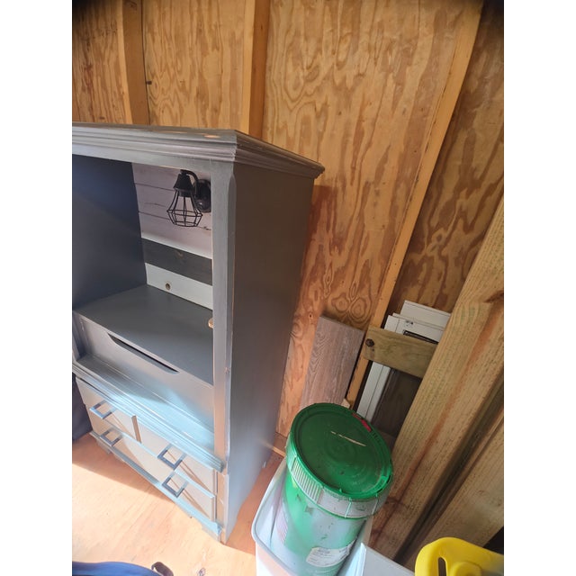 This solid wood Thomasville armoire was upcycled into a farmhouse style coffeebar. Refinished with a gray chalk paint,...
