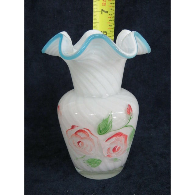 This beautiful Vase is made out of glass. This Vase has incredible vintage style with a classic ruffled rim silhouette, a...