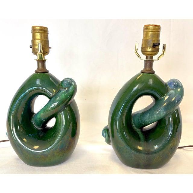 Groovy pair of Royal Haeger style lamps from the mid 20th century. They are made of ceramic with an organic mobius-like...