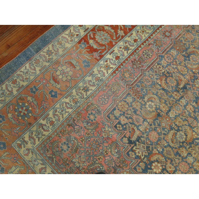 a lovely oversize Persian bibikabad rug with a herati motif in blues, pink, terracottas, circa 1910 Details rug no. j1411...