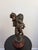 Late 19th- to early 20th-century French Vendangeur sculpture in brown-patinated cast spelter, styled after the mid-19th-...