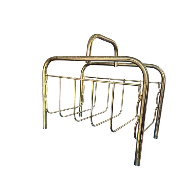 Add a touch of vintage charm to your living room, office, or reading nook with this brass-tone metal magazine rack....