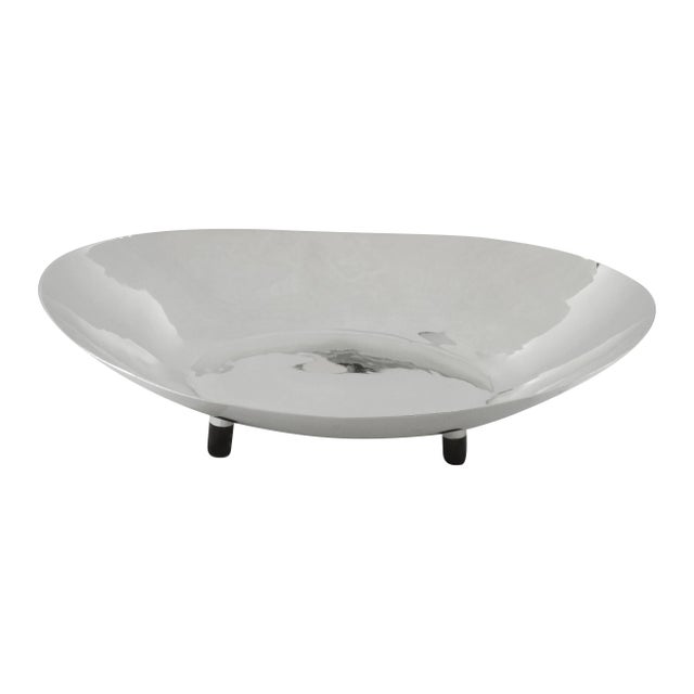 True to the arts-and-crafts school of design is this three-piece hand-wrought suite: bowl and matching candlesticks made...