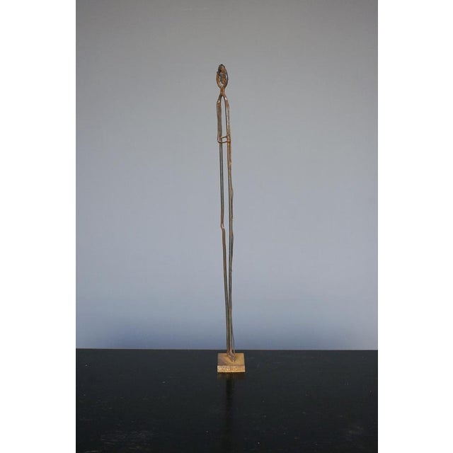 An interesting steel sculpture of a standing figure using metal as a silhouette. It would look great as an eye catcher to...