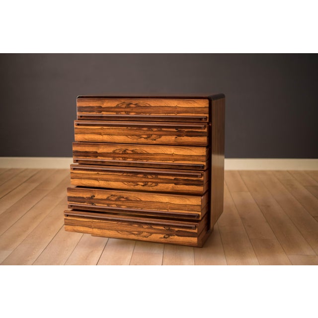 Vintage tall highboy dresser chest by Westnofa of Norway, circa 1970's. This unique piece displays stunning rosewood...