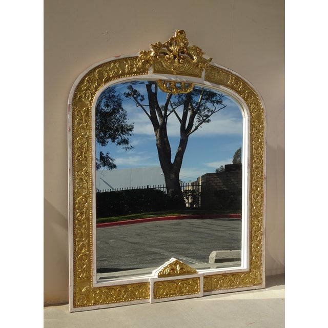 Gorgeous Mirror in Good Antique Condition. Solid and Firm. The white frame has been distressed to give its rustic look....