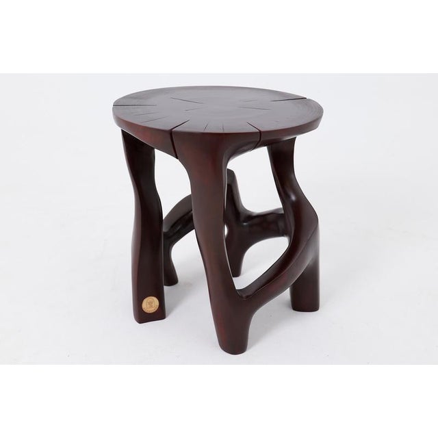 This extraordinary sculptural stool is a one of a kind piece, carved from a single solid hardwood log. Its complex,...