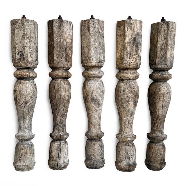 Hand-turned vintage Indian teak banister legs featuring beautifully weathered surfaces and expressive natural patina...