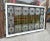 Antique, geometric patterned skylight with leaded, stained and textured glass. This whimsically designed window has a...