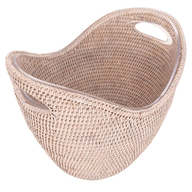 The new rattan champagne bucket with an acrylic insert gives your champagne or wine a modern display while keeping it...