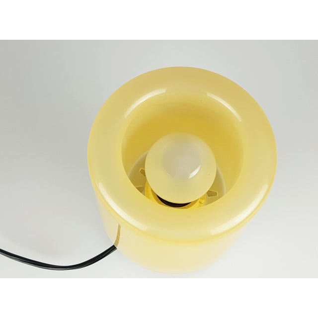 This small table lamp was produced by Kartell, Italy in 1971. The lamp is made from a chromed ABS plastic base and a...