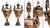 Classic pair of gilt and bronze urns of amphora form In the Grecian style, these would add classical elegance to any room...