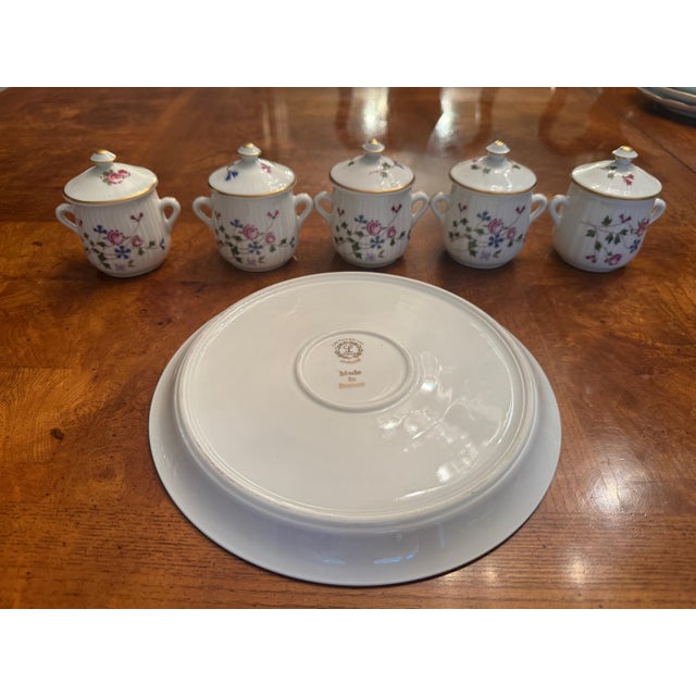 A beautiful set by Louis Lourioux- a highly collectible French porcelain house. The logo with the little running faun/pan...