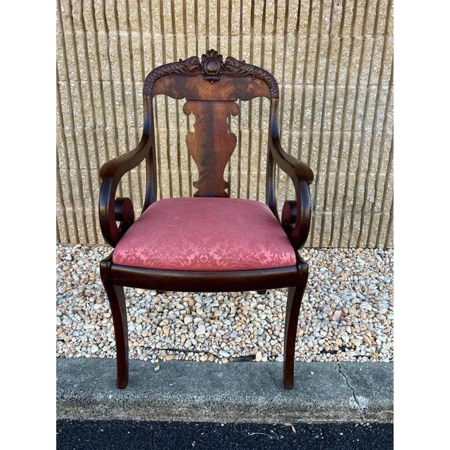 French Empire Style Flame Mahogany Armchair. 19th Century. Well made, carved details with dragon pattern on top...