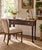 Charming vintage writing table or petite console featuring a slender dark-stained wood frame, elegant tapered legs and a...