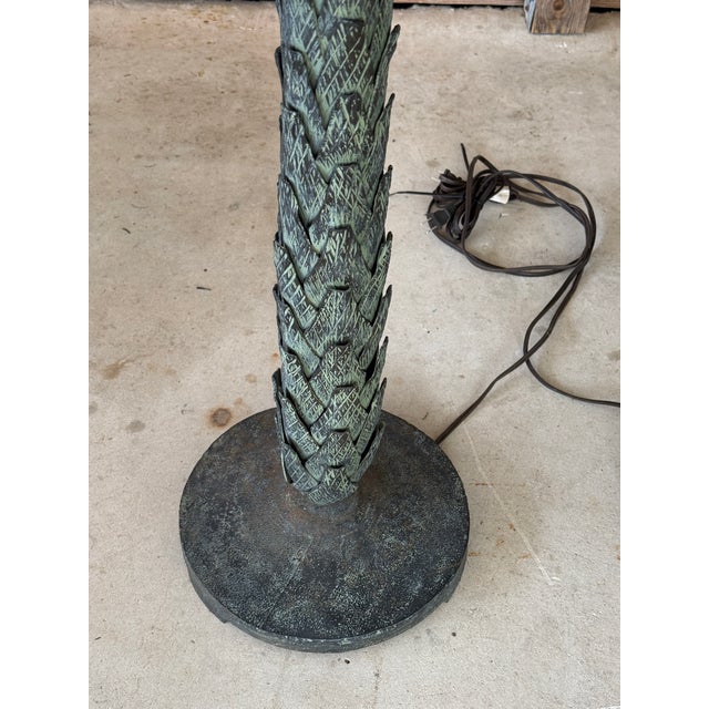 An exceptionally rare pair of monumental palm tree floor lamps, attributed to Maison Jansen, the renowned Parisian design...