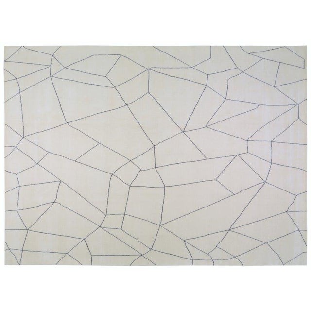 Hand-knotted with care using traditional rug-making techniques, this wool rug blends timeless craftsmanship with a modern...