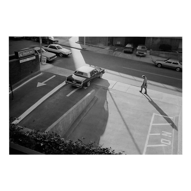 Michael Ormerod, Man Walking Past Parking Lot, Photographic Print For Sale