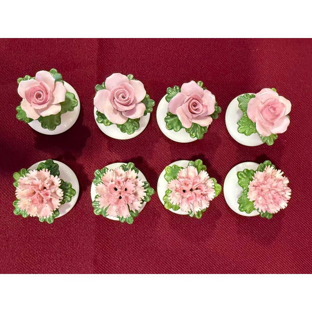 A set of eight (8) vintage miniature porcelain individual salt and pepper shakers (four matching pairs). The set features...