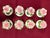 A set of eight (8) vintage miniature porcelain individual salt and pepper shakers (four matching pairs). The set features...