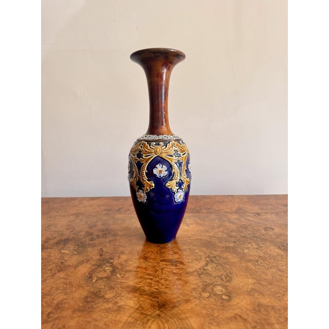 Lovely antique Doulton Lambeth vase having a lovely shaped vase decorated on a blue ground with mustard coloured swags and...
