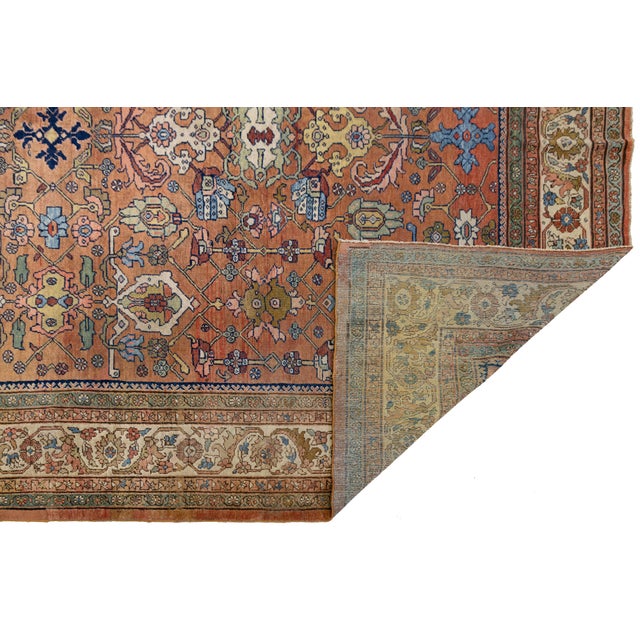 This authentic vintage Mahal rug embodies the timeless charm of Persian village weaving. Featuring a rich, warm terracotta...