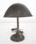Early 20th century gooseneck office desk lamp made of a brown painted steel arm and shade and a cast iron base. It...
