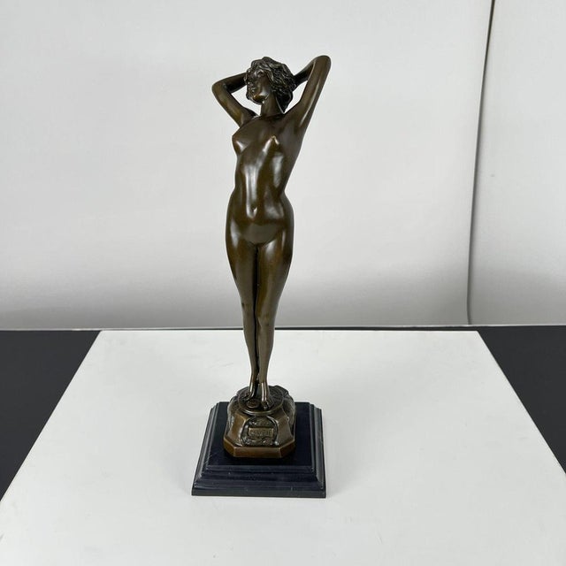 Art deco bronze sculpture of a standing, naked woman titled ‘reveil’ (french for ‘awakening’), from paris, france, circa...