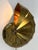 Unique, elegant and highly decorative mid-century modern brass sconce or light object 'natilius'. Designed & manufactured...