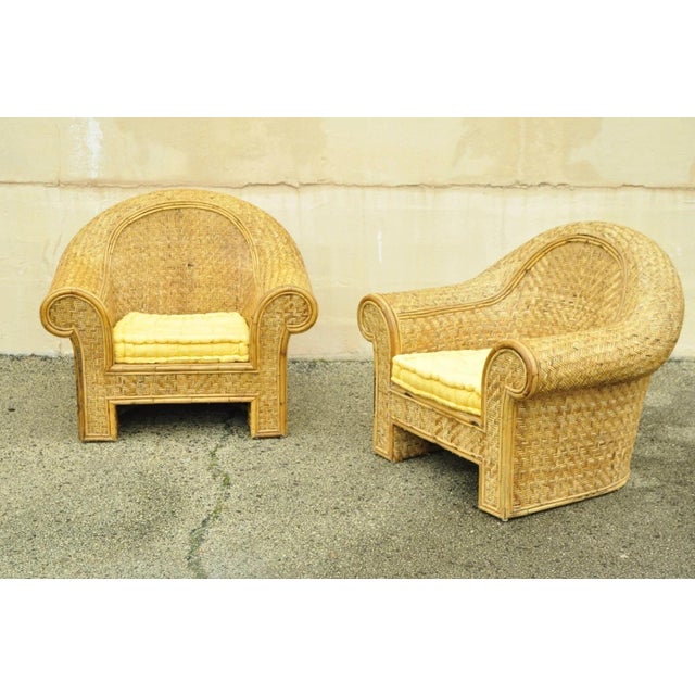 Vintage Ralph Lauren Attributed Large Woven Wicker Rattan Club Lounge Chairs - a Pair. Chairs feature large impressive...