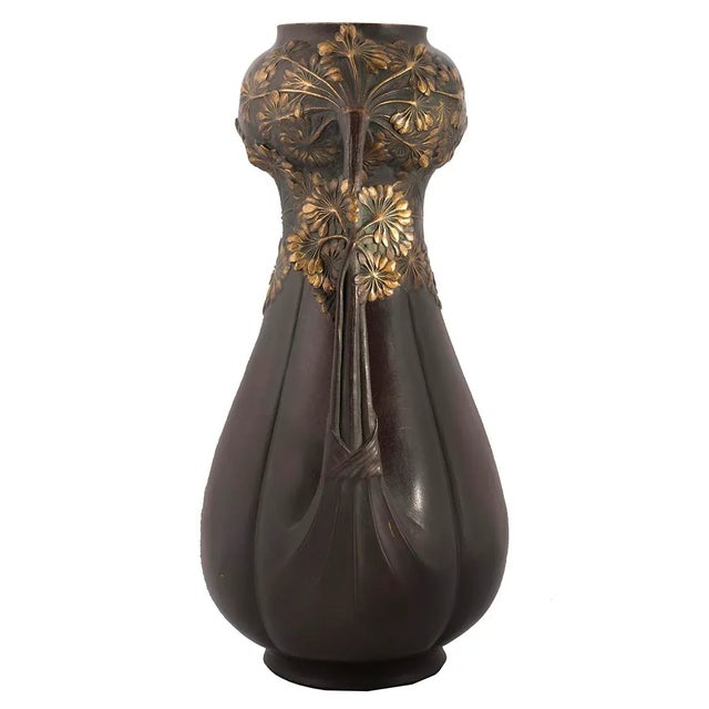 Vases by Leon Kann, 1859-1925 French. A fine Pair of Art Nouveau vases with a deep rich patinated and gilt surface with...