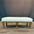 Elegant French carved walnut footstool featuring a shaped apron with finely carved shell and scroll detailing, raised on...